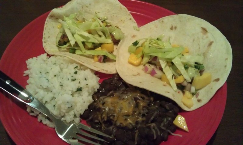 And dinner is served... Baja tacos with cabbage and homemade mango salsa, c